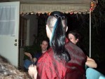 Mark illustrating his, uhhh, ponytailed man mullet?