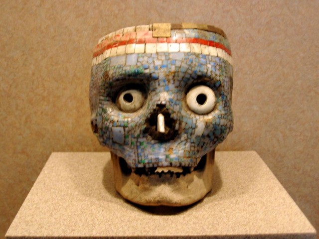 Skulls just aren't scary enough unless you plaster 'em with tiny rocks and stick big fake freaky eyes into the eye sockets.  Yeek.